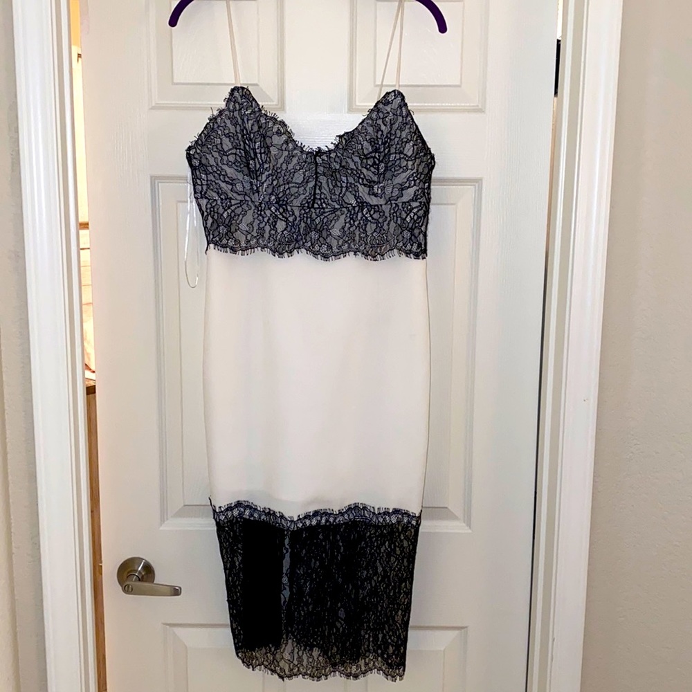 Brand new white dress with Black Lace details